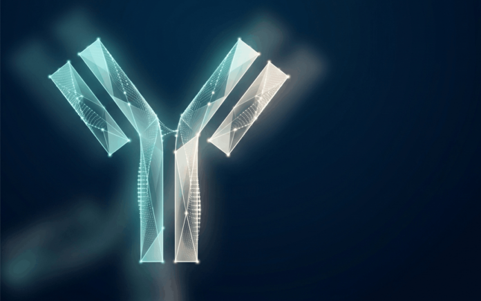 Abstract illustration of a Y-shaped antibody structure formed from glowing points of light on a dark blue background.